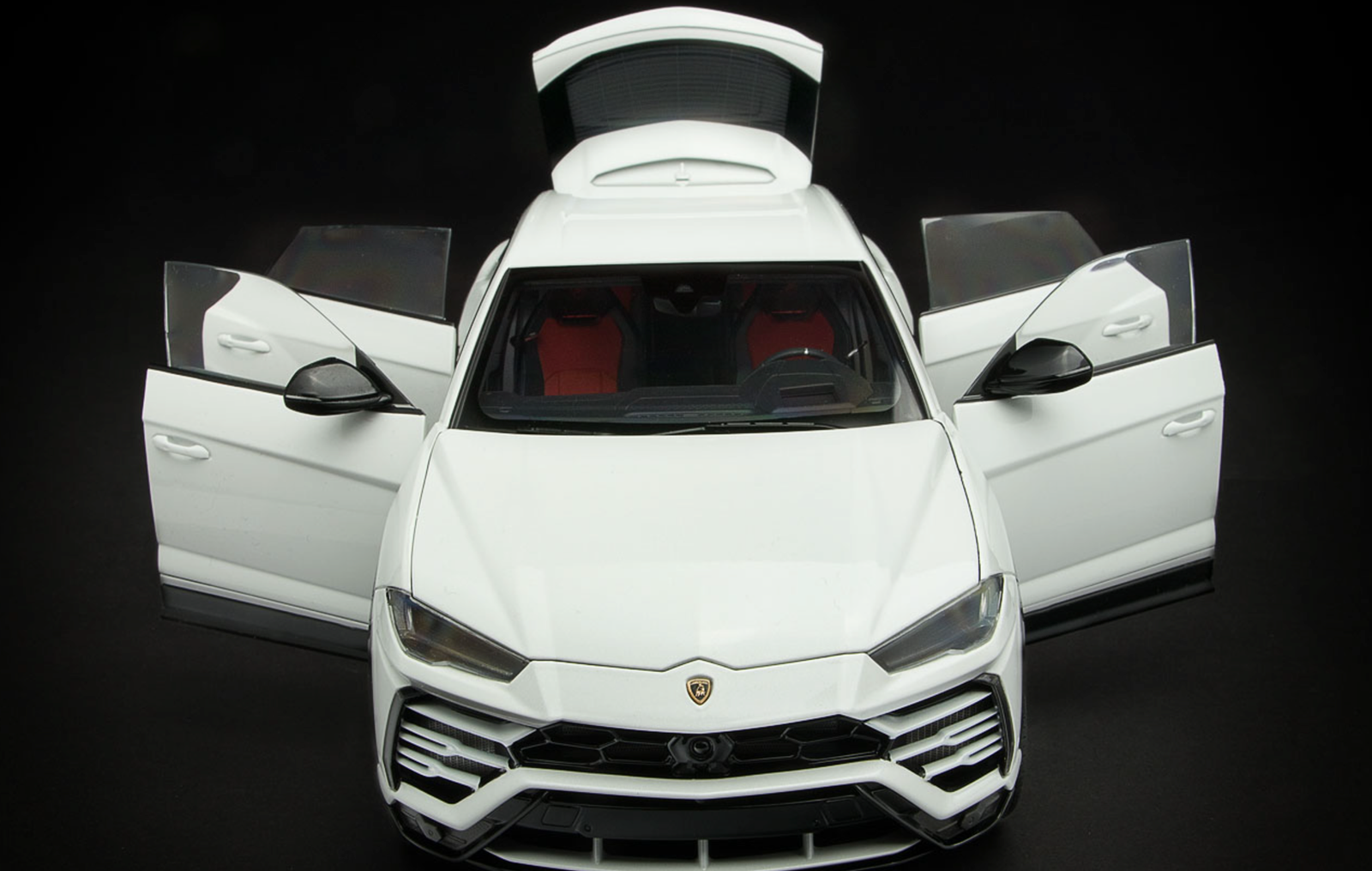 White Lamborghini Urus luxury super SUV with doors open for dramatic wedding arrival