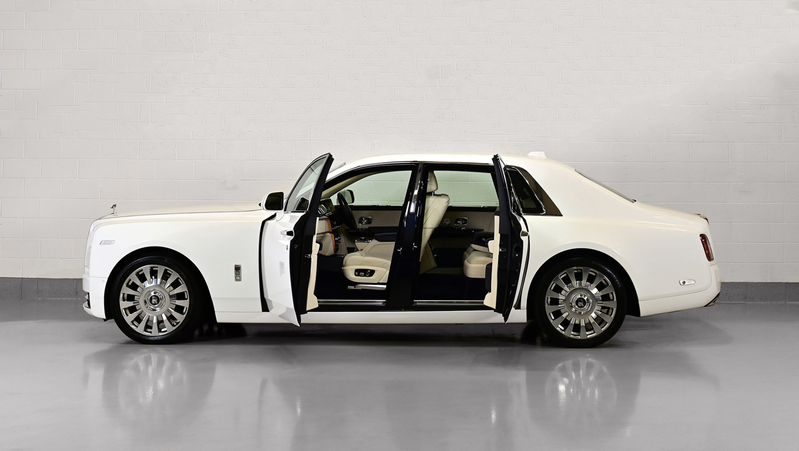 Rolls-Royce Phantom luxury wedding chauffeur vehicle with signature coach doors open for bridal arrival