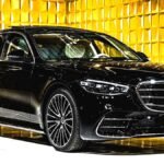 Luxury Car on Red Carpet Outside Elegant Venue