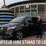 Black Mercedes chauffeur vehicle with driver at Etihad Stadium ready for London journey