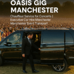 Professional chauffeur opening Mercedes V-Class MPV at Oasis gig in Manchester with thousands of concertgoers in the background.