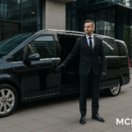 Business chauffeur opening luxury MPV at corporate office
