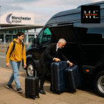 A professional chauffeur loads luggage into a minibus while students prepare to travel from Nottingham to Manchester Airport