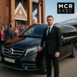 Professional chauffeur opening luxury Mercedes V-Class for Norwegian tourists visiting Liverpool FC match
