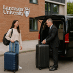Young Lancaster University student placing luggage into a premium chauffeur vehicle before transfer to Manchester Airport
