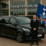 Luxury executive taxi at Etihad Stadium for Man City vs Tottenham Hotspur match, Spurs fans waving flag