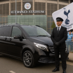 Executive MPV with chauffeur at Etihad Stadium for Man City vs Tottenham Hotspur match, Spurs fans holding flag