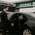Professional chauffeur opening limousine door at Manchester Airport