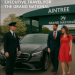 A couple dressed for race day arrives at Aintree Racecourse from Manchester in a luxury black Mercedes, greeted by a professional chauffeur