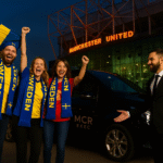 Three Swedish Manchester United fans beside a Mercedes MPV at Old Trafford with MCR EXEC chauffeur and logo visible.