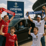 Ultra HD image of Liverpool vs Real Madrid Champions League 2025 fans arriving at Anfield in a black 2025 Mercedes V-Class MPV with MCR EXEC chauffeur service. Both Liverpool and Real Madrid supporters in red and white are waving scarves outside the luxury vehicle under the stadium lights.