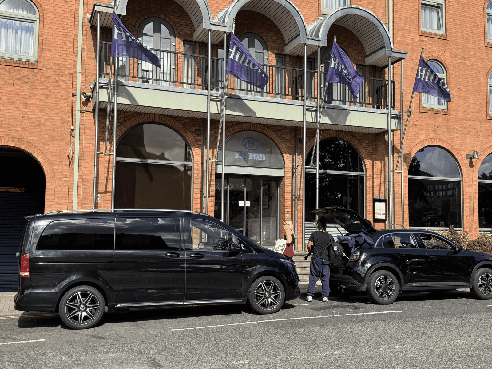 Chauffeur from Manchester Airport to Hilton Hotel York a black Mercedes V-Class outside Hilton York.