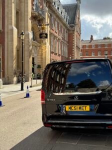MCR EXEC Mercedes V-Class parked outside The Grand Hotel York, ready for luxury chauffeur transfer to Manchester Airport.