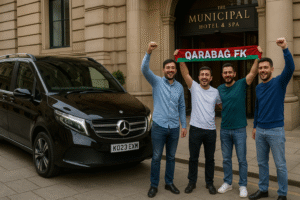 Qarabağ FK Azerbaijani football fans outside The Municipal Hotel & Spa in Liverpool with a black Mercedes V-Class chauffeur car operated by MCR EXEC, celebrating ahead of the Champions League match at Anfield.