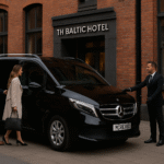 Mercedes V-Class with MCR EXEC chauffeur outside The Baltic Hotel Liverpool, passengers boarding for Manchester Airport transfer.