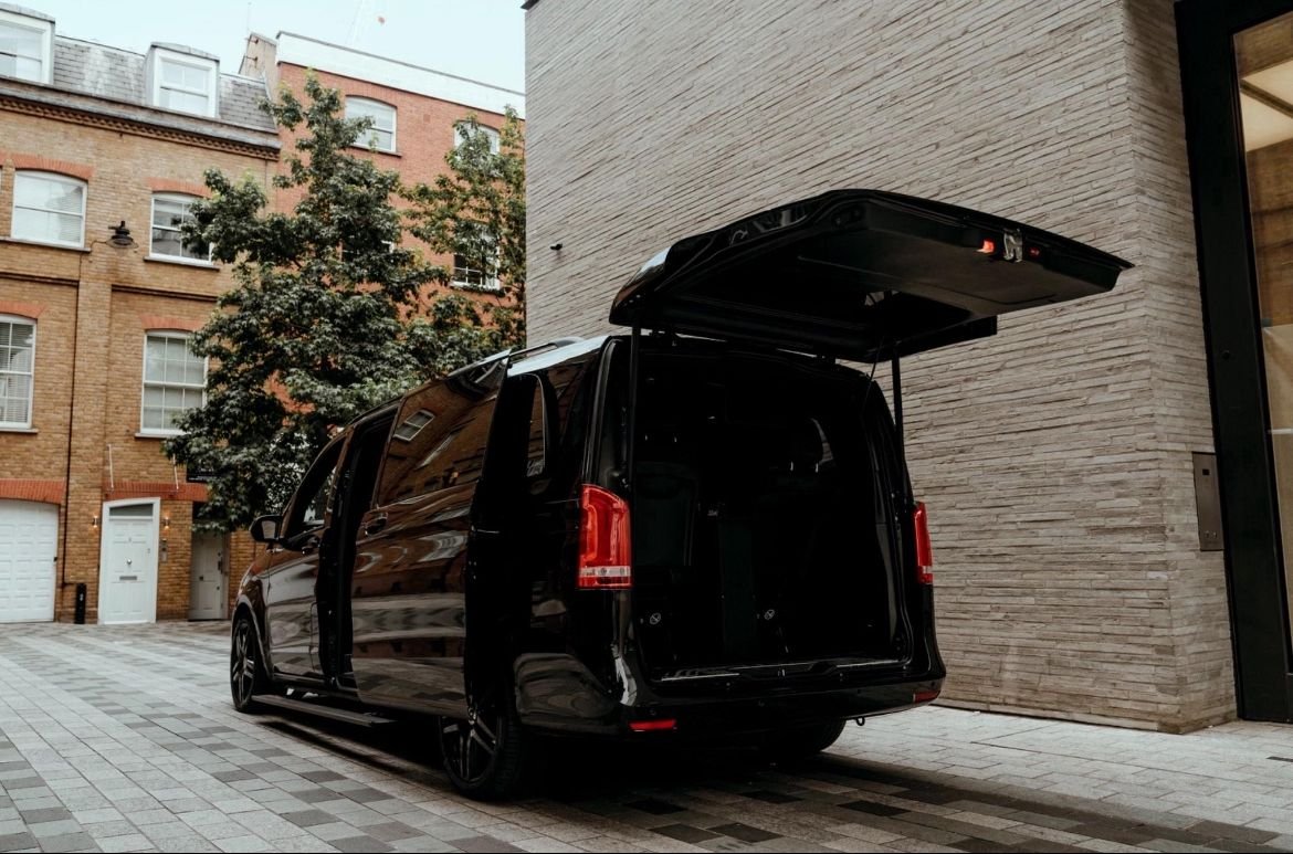 Black customised Mercedes V-Class ready for passenger boarding
