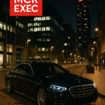 Black Mercedes-Benz S-Class parked in Spinningfields Manchester at night with MCR EXEC logo, luxury chauffeur service scene.