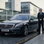 Chauffeur service Liverpool showing a professional chauffeur standing beside a black Mercedes-Benz S-Class executive saloon on a city street, featuring MCR-EXEC number plates and providing premium chauffeur service in Liverpool by MCR EXEC.