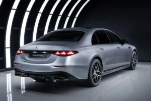 Mercedes S-Class 2026 luxury chauffeur vehicle in metallic silver, rear three-quarter studio view showing refined body lines and LED lighting, premium executive transport by MCR-EXEC.