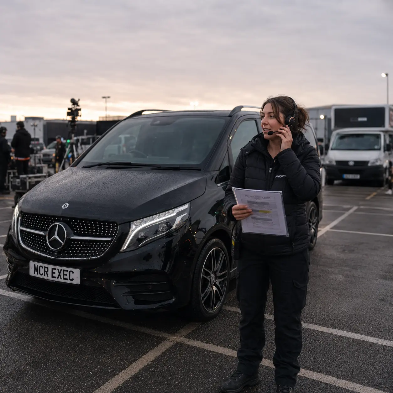 Film and TV production transport planning in Manchester with a production coordinator and black Mercedes V-Class chauffeur vehicle by MCR EXEC at dawn
