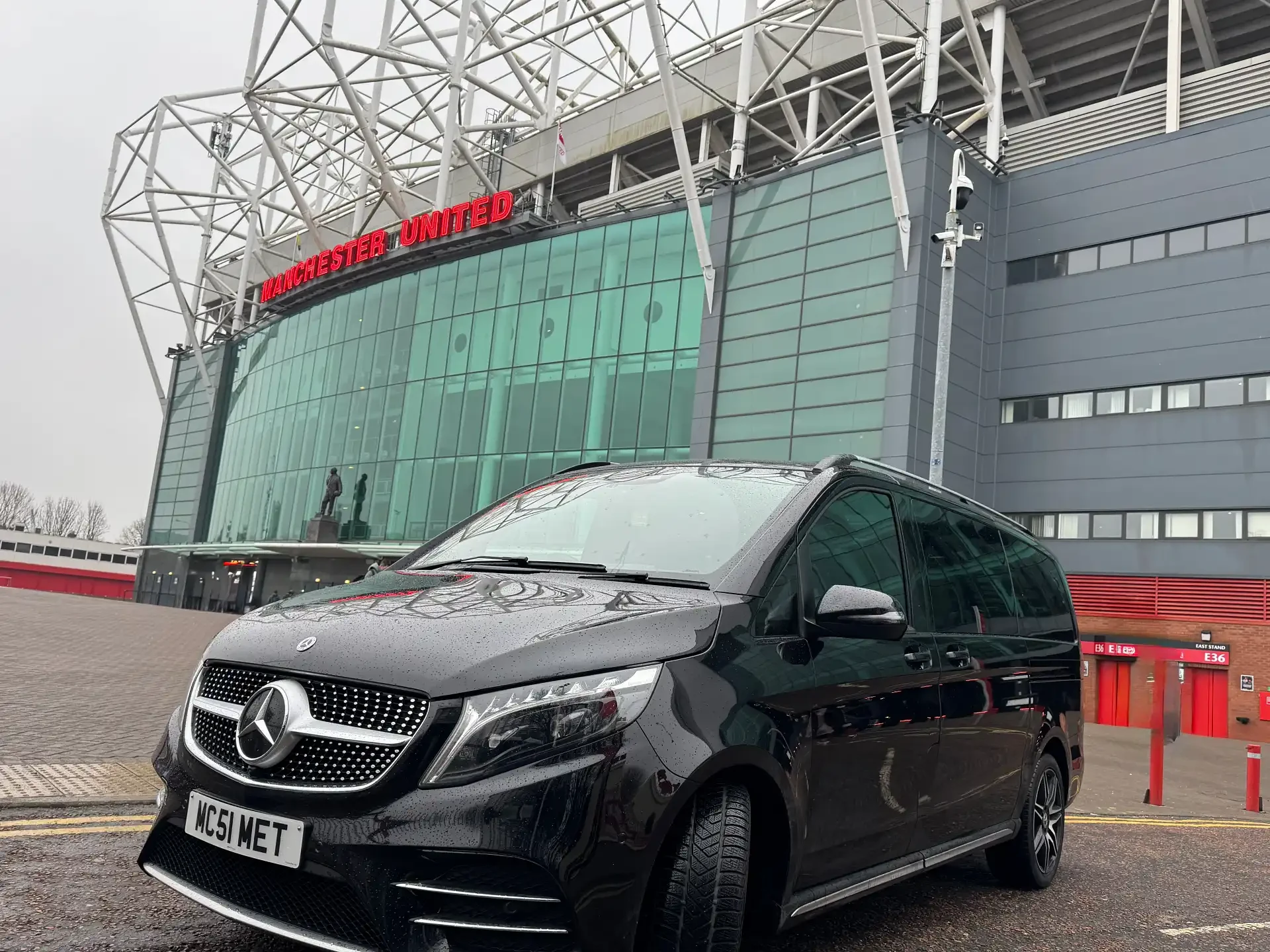 Black Mercedes chauffeur vehicle prepared for an Old Trafford collection