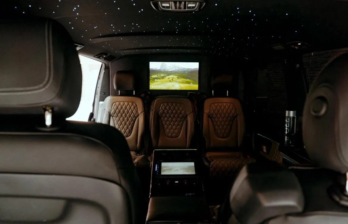Luxury AC13-style prom car hire Manchester console detail with premium custom V-Class interior by MCR EXEC