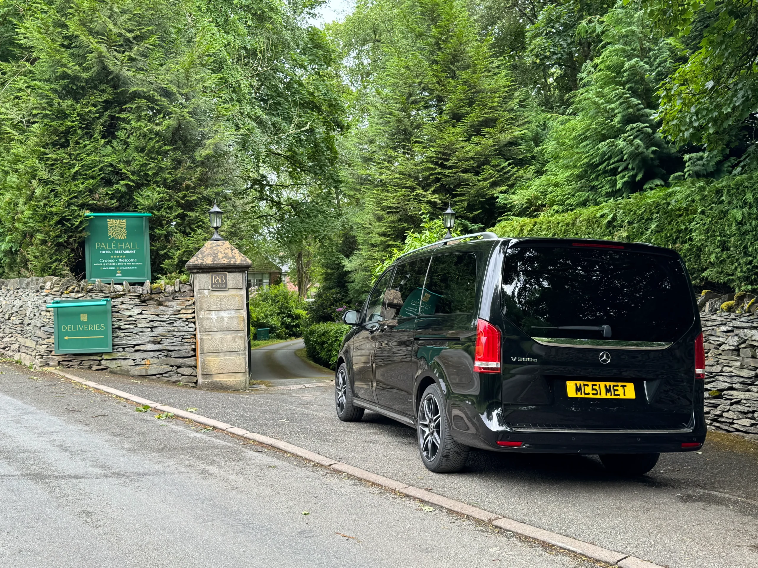 Private UK tours with chauffeur Mercedes V-Class arriving at Palé Hall for full-day and multi-day private travel