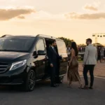 Barton Live Chauffeur Service at Barton Aerodrome Eccles with a black Mercedes V-Class MCR EXEC vehicle and professional chauffeur assisting concert guests.