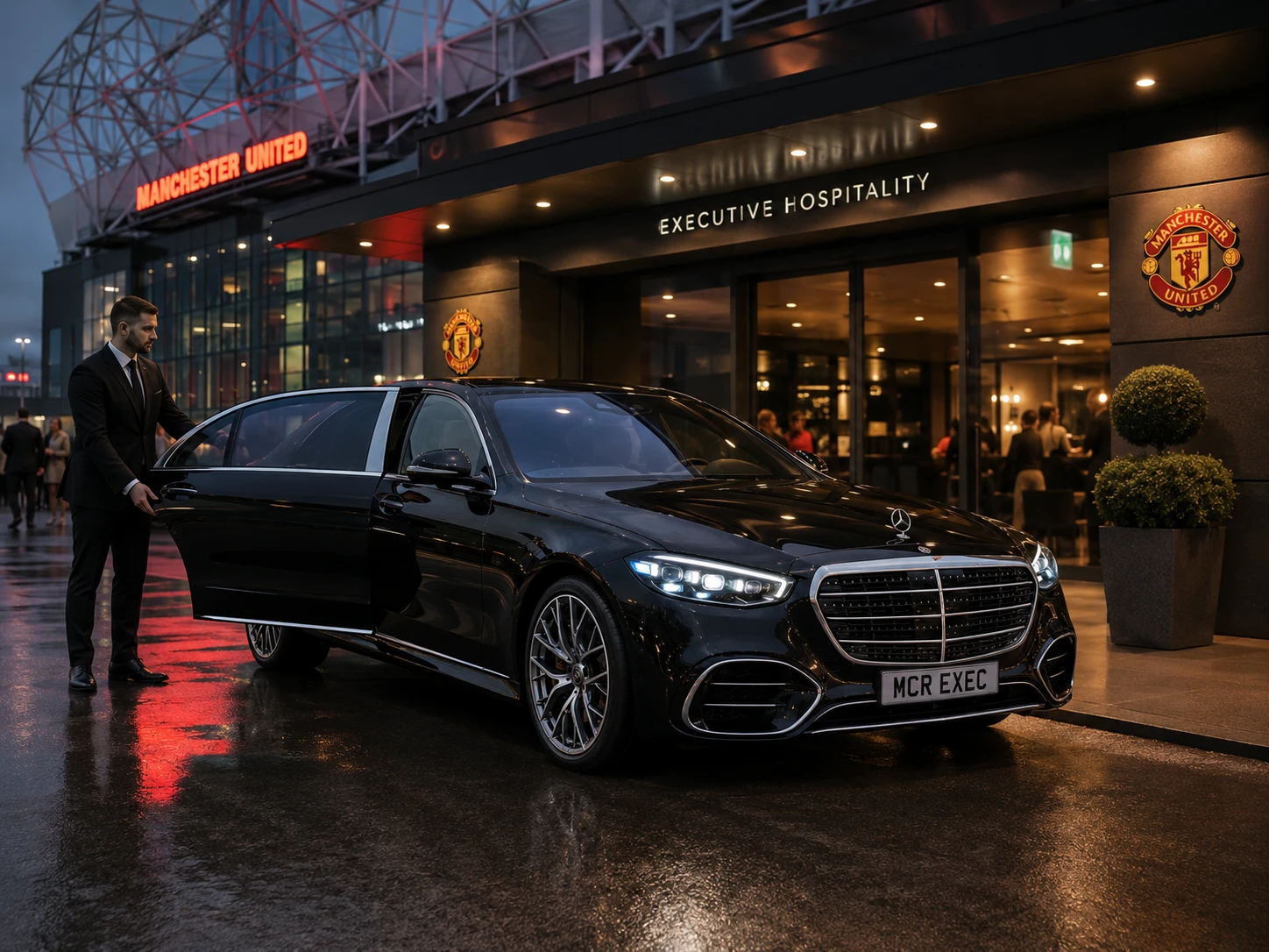 Black Mercedes S-Class with MCR EXEC number plate outside Old Trafford executive hospitality entrance