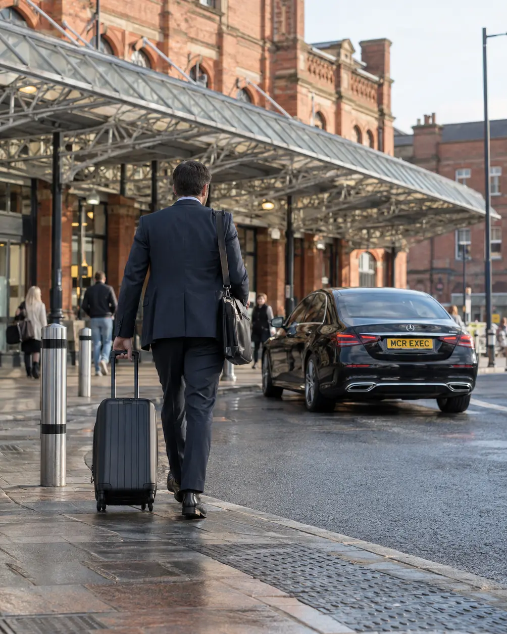 MCR EXEC Mercedes at a Preston rail connection for a planned onward journey