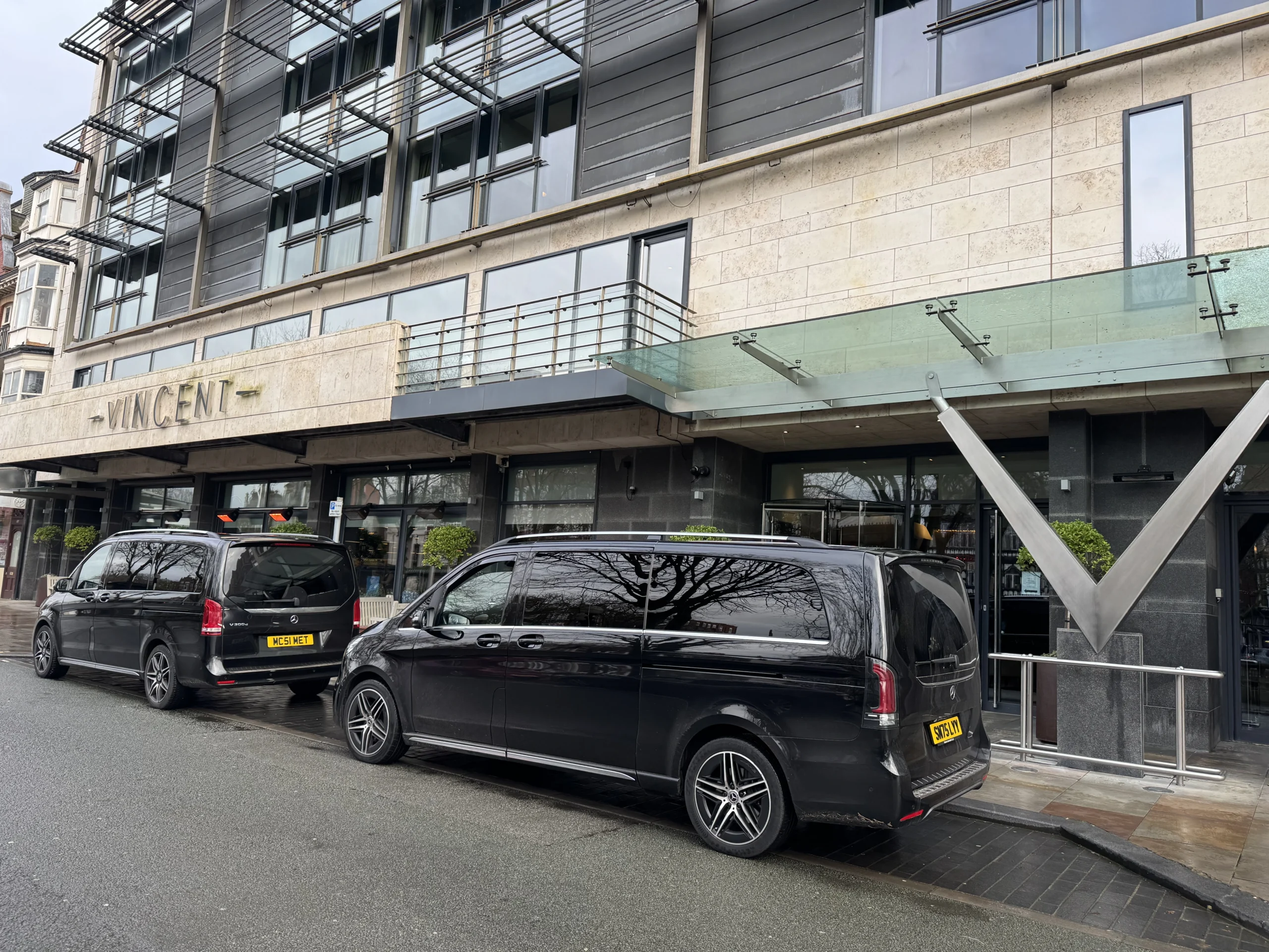 Two black Mercedes V-Classes outside the Vincent Hotel in Southport during the Tripadvisor coastal shoot