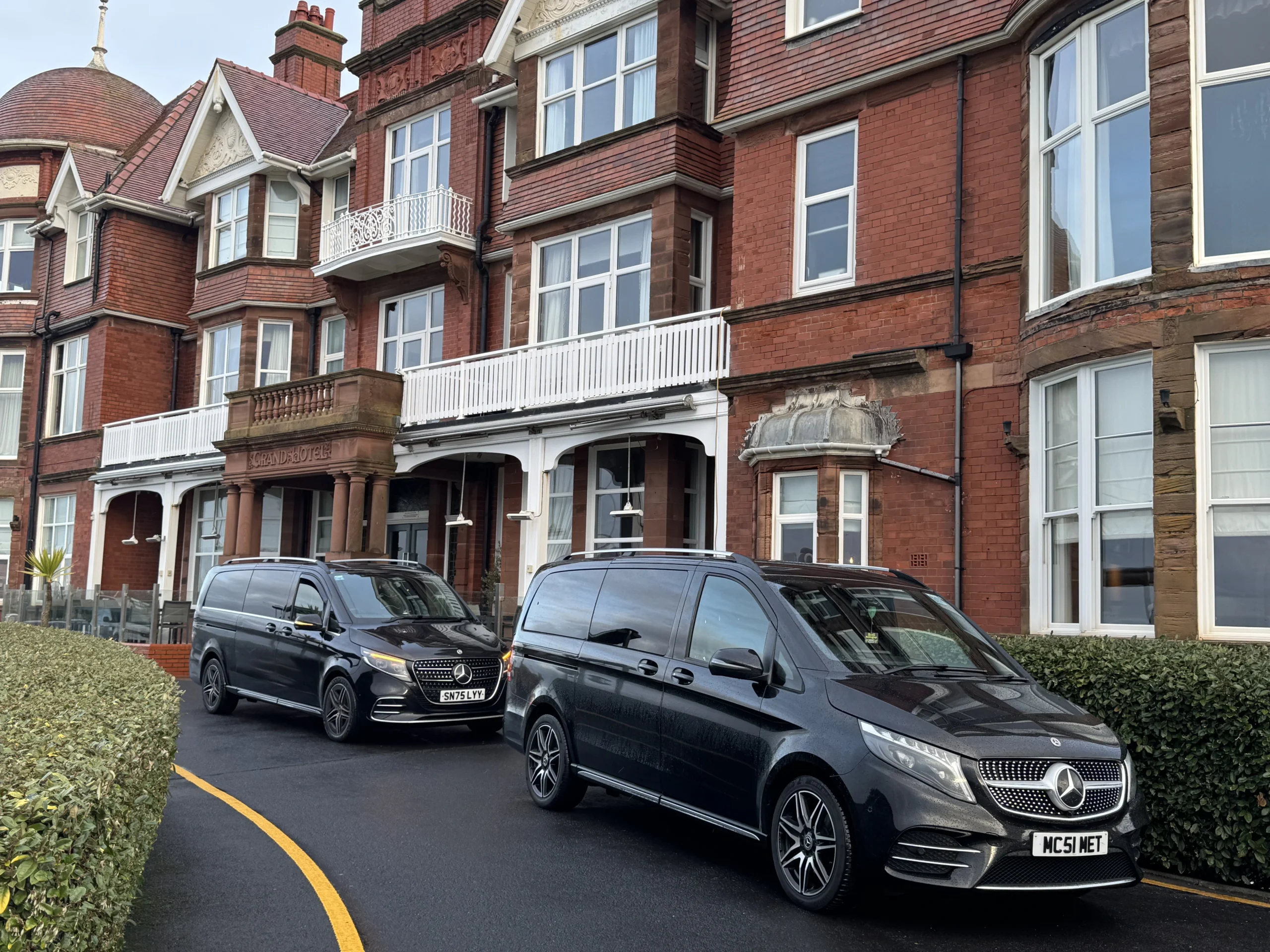 Two black Mercedes V-Classes outside the Grand Hotel in Lytham St Annes during the Tripadvisor production booking